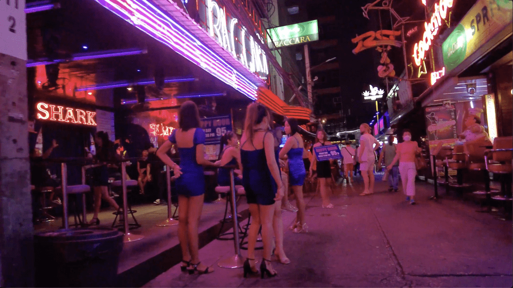 Go Go girls stood outside the bars