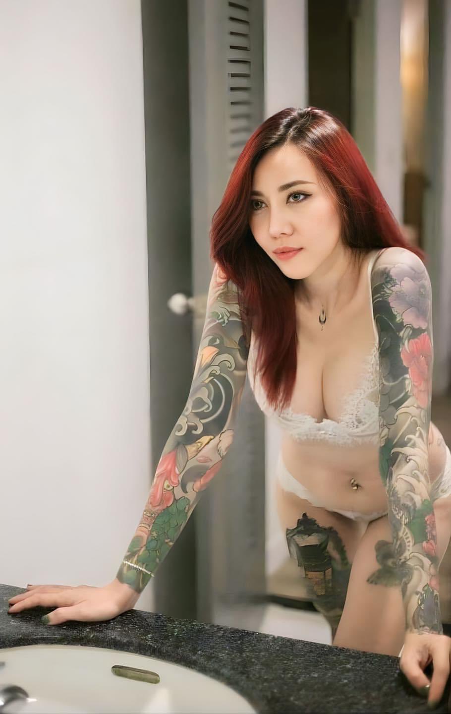 tattooed thai girl with red hair wearing white underwear