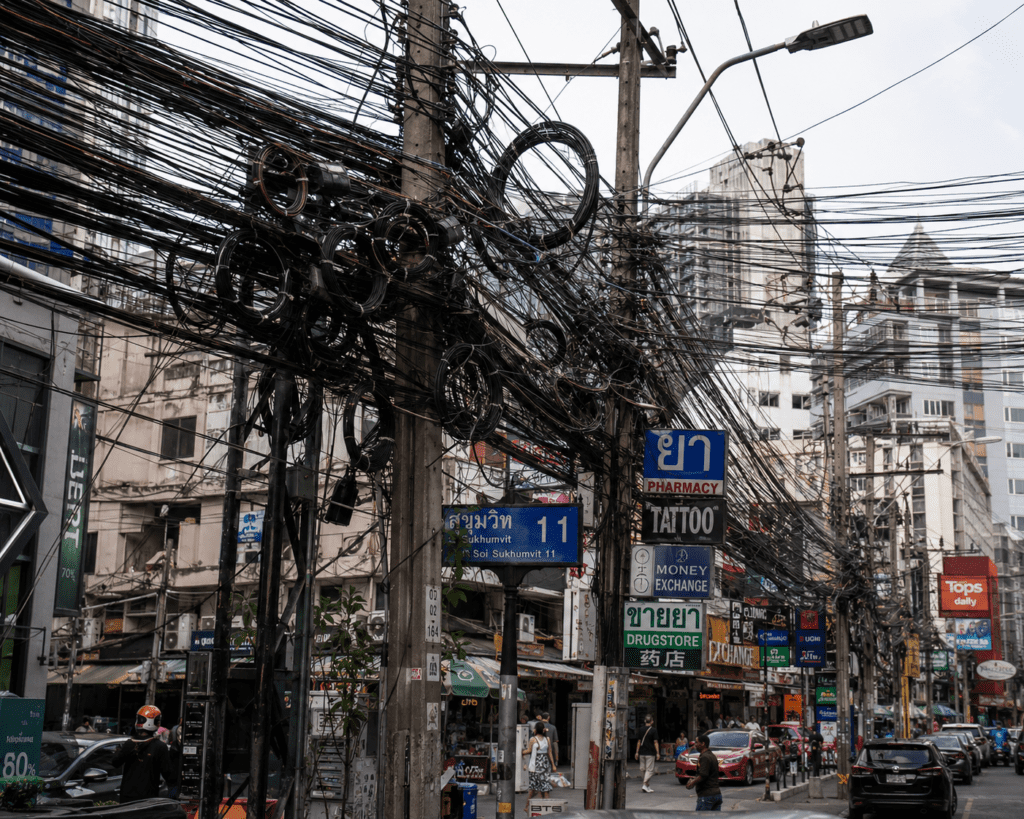Messy electrical wires on poles across Thailand